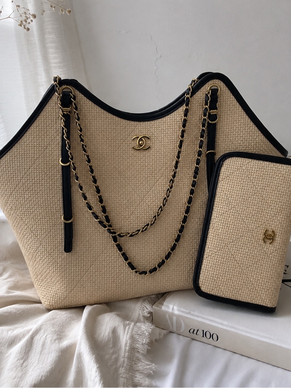 CHANEL Beige Raffia Tote with Black Trim and Gold Chain